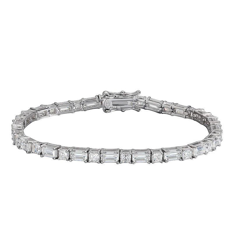 Elegant emerald-cut moissanite tennis bracelet featuring sparkling rectangular and round stones in polished silver prong settings, with a secure box clasp and safety latch, displayed on a clean white background.